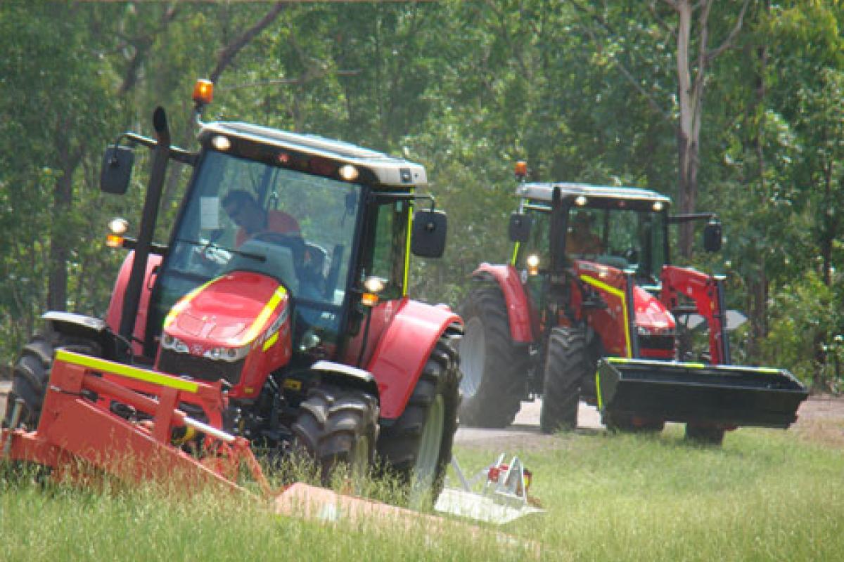 Tractors clearing weeds