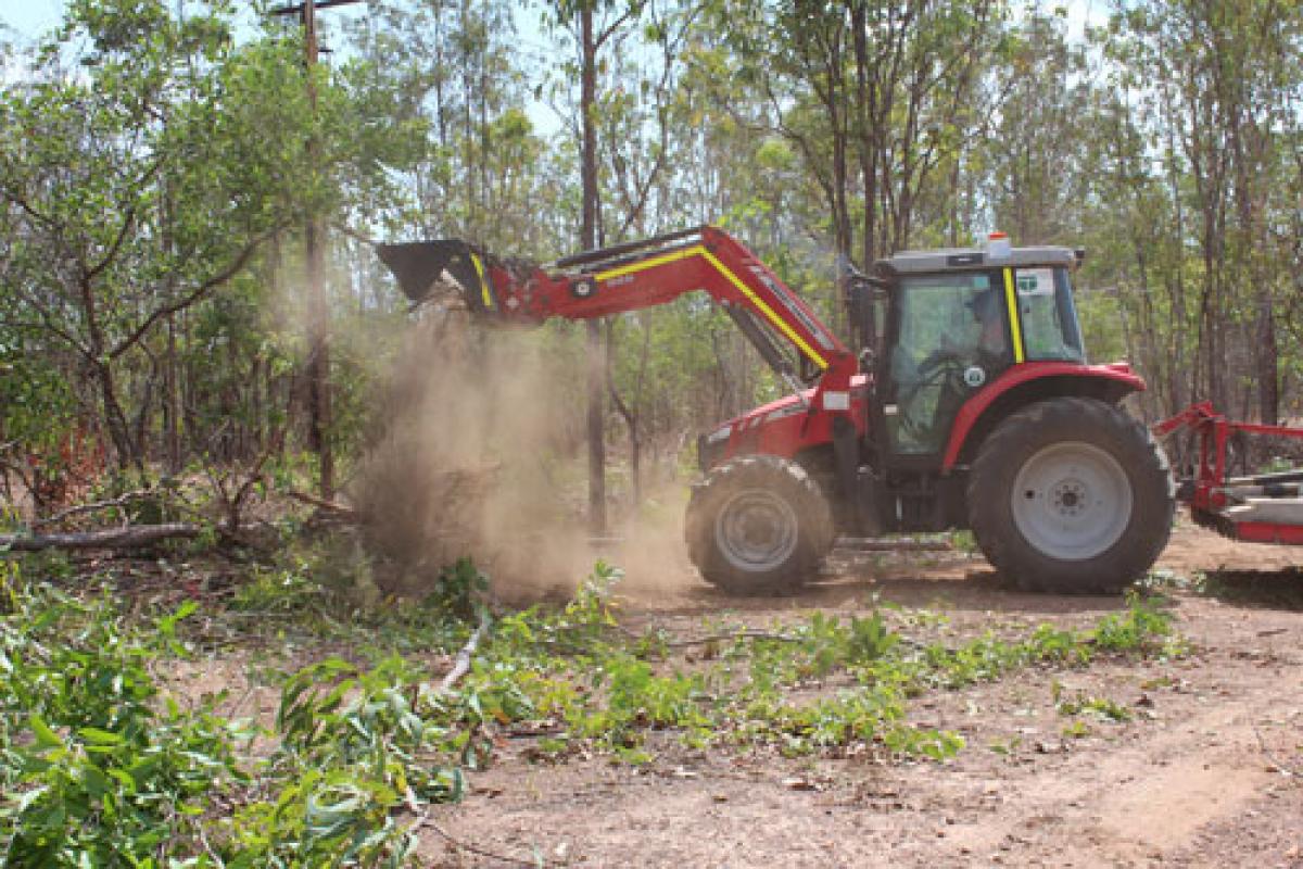 Tractor dumping dirt