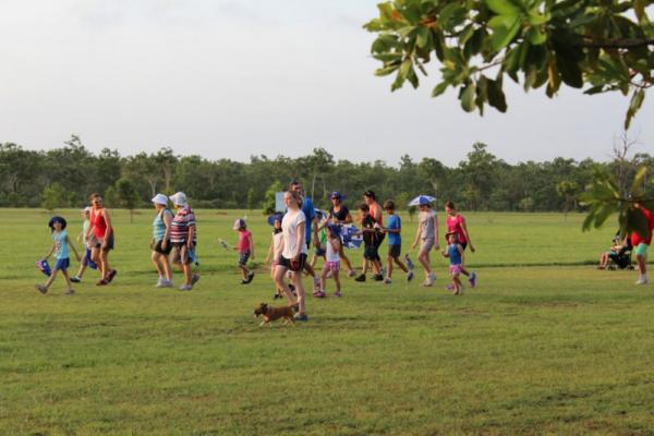 Group of people out on large grassed area